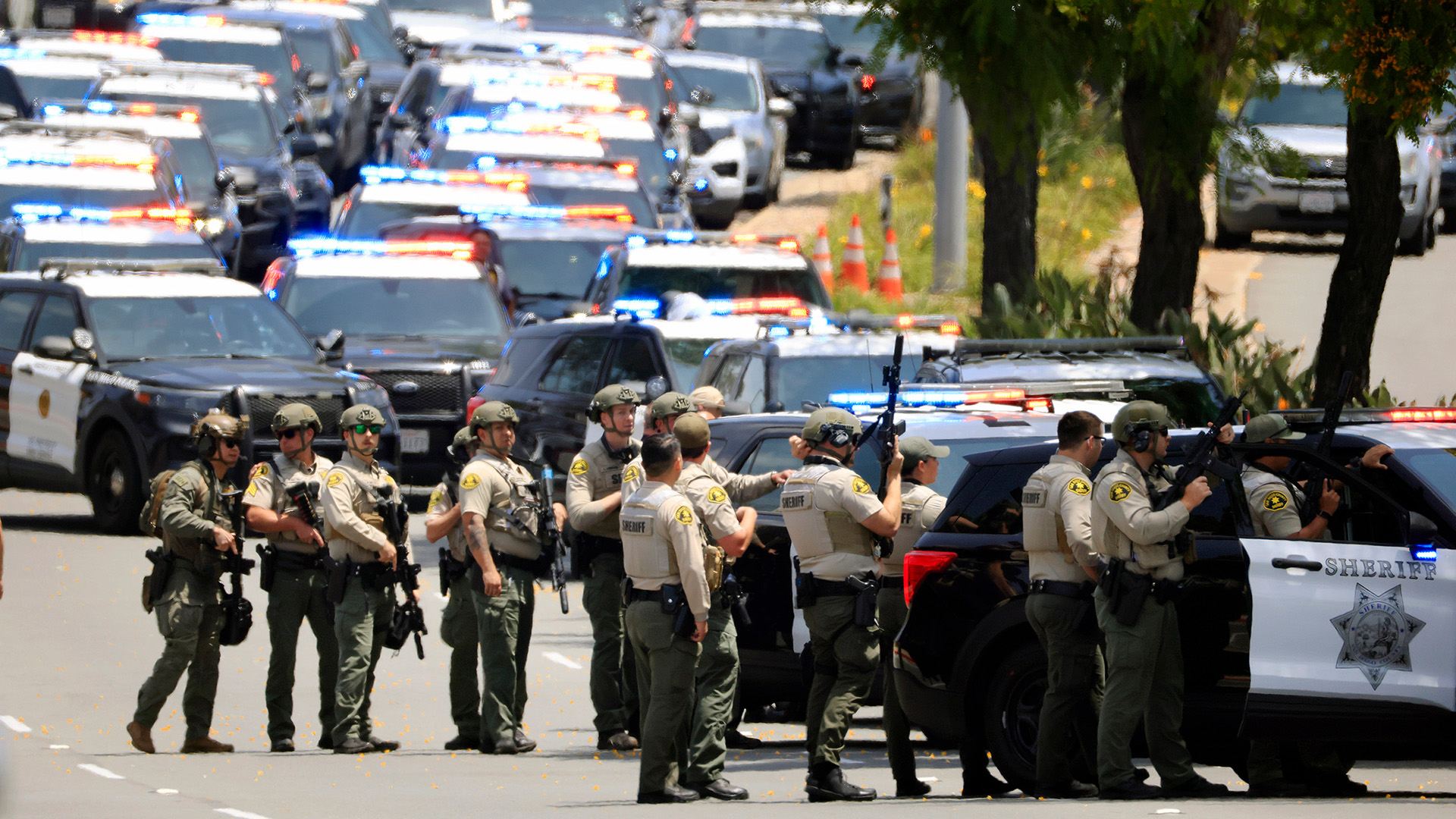 police gathering at the scene of the shooting in San Diego